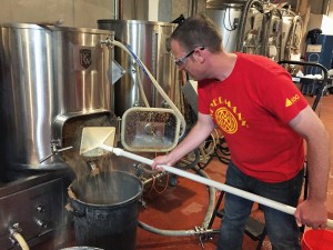 Mucking out the mash tun.